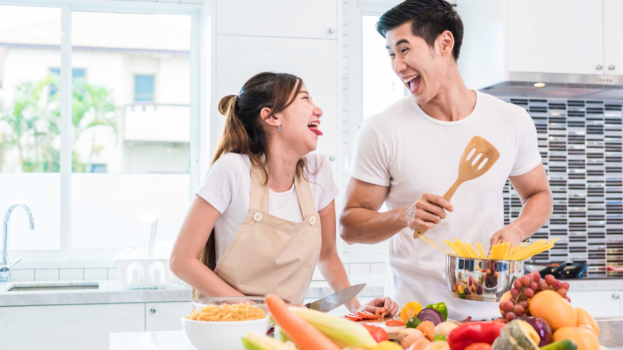 Couple Cooking Laughing Smiling