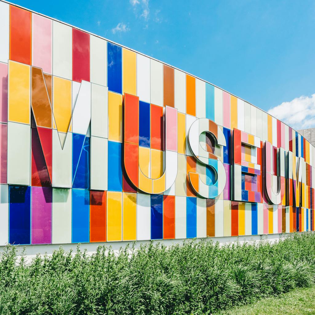 Colorful vertical panels create a vibrant and modern museum facade.