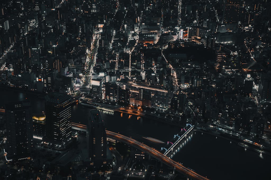 A captivating aerial view of Tokyo's luminous cityscape at night, showcasing urban life and architecture.