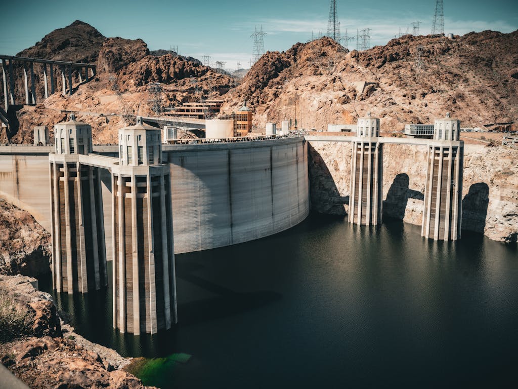 A majestic view of Hoover Dam against a desert landscape, showcasing American engineering