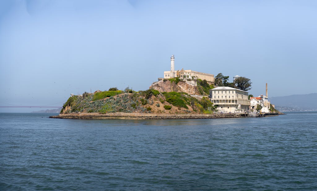 A scenic view of Alcatraz Island and its historic buildings in San Francisco Bay.