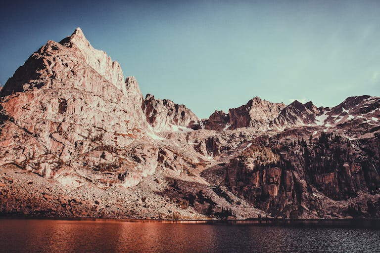 Breathtaking view of the rugged Rocky Mountains against a clear sky in Colorado.