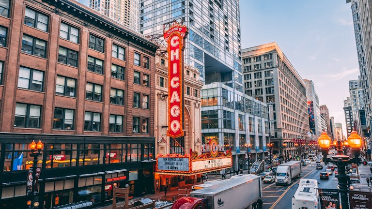 Bustling downtown Chicago street featuring iconic Chicago Theatre on a lively evening.