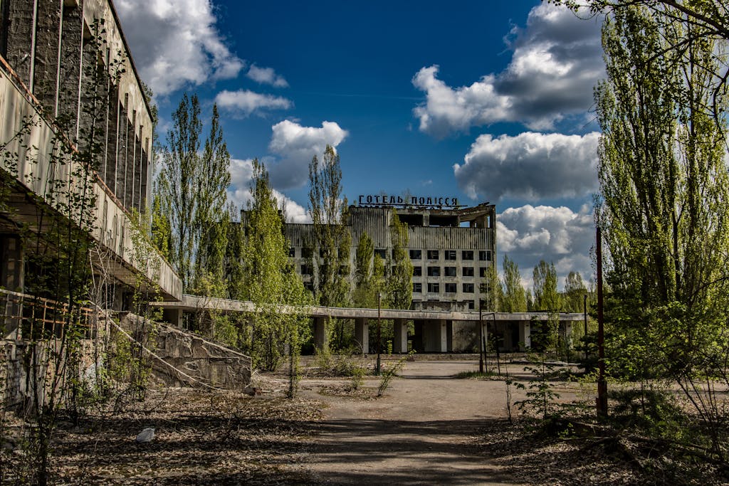 Deserted structure overgrown by nature in Chernobyl, Ukraine, reflecting post-disaster decay.