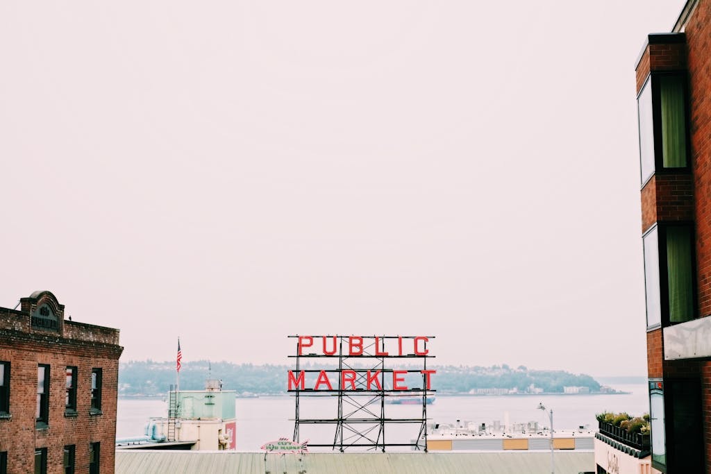 Iconic Public Market sign amid urban structures, offering a classic cityscape view.