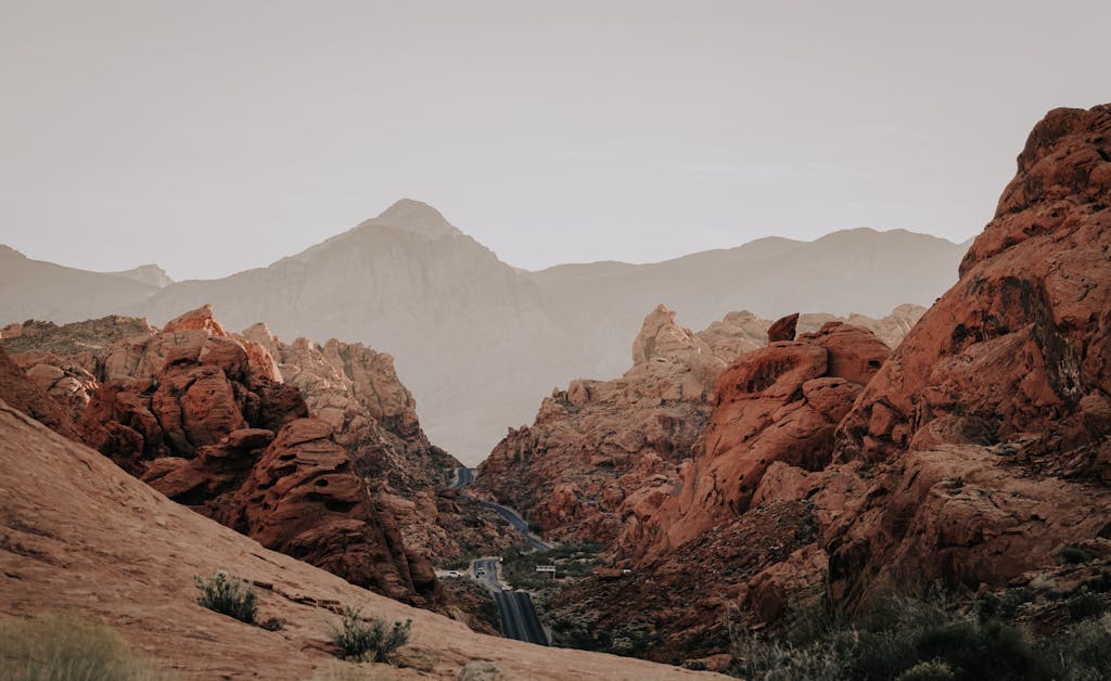 Stunning view of Red Rock Canyon's unique sandstone formations under clear skies in Clark County, Nevada.