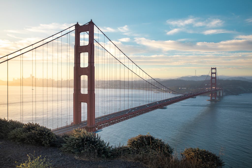 The iconic Golden Gate Bridge captured at sunrise from Sausalito, California.