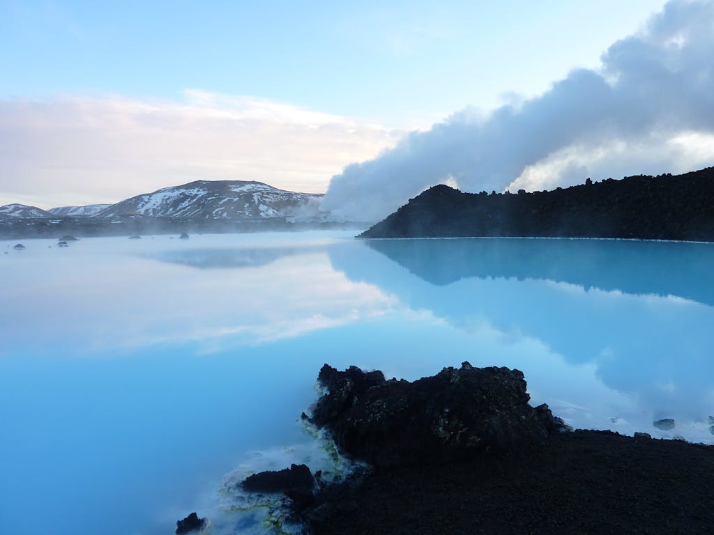 Captivating view of the Blue Lagoon in Iceland with steaming geothermal waters and distant mountains.