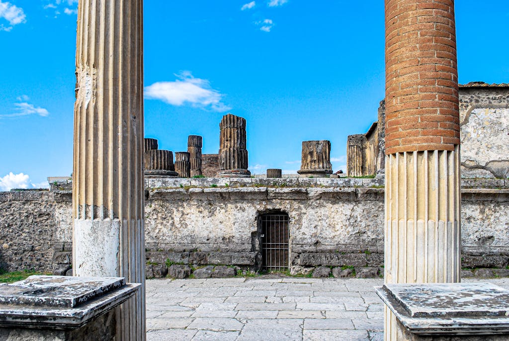 Explore the ancient Roman columns and ruins at Pompeii, showcasing historical architecture. Perfect for travel and history enthusiasts.