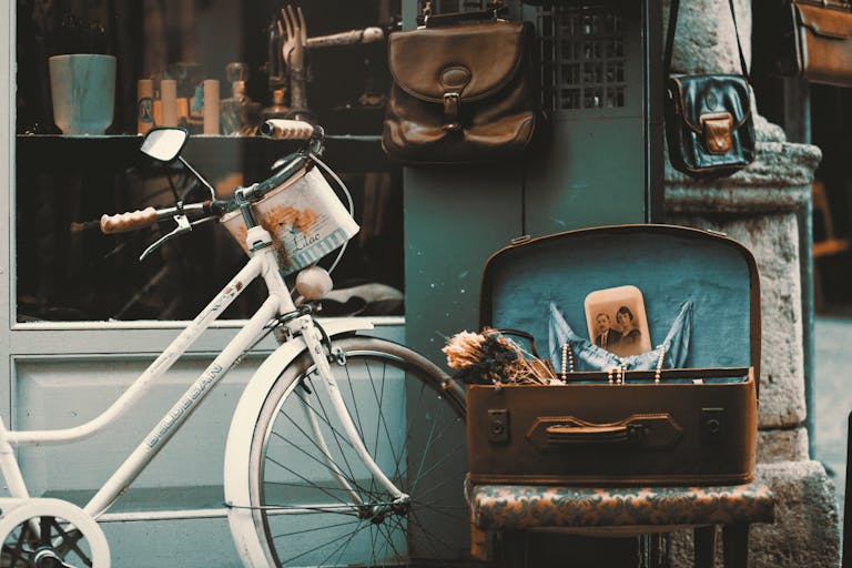 Retro-themed outdoor scene with vintage bicycle, suitcase, and nostalgic elements.