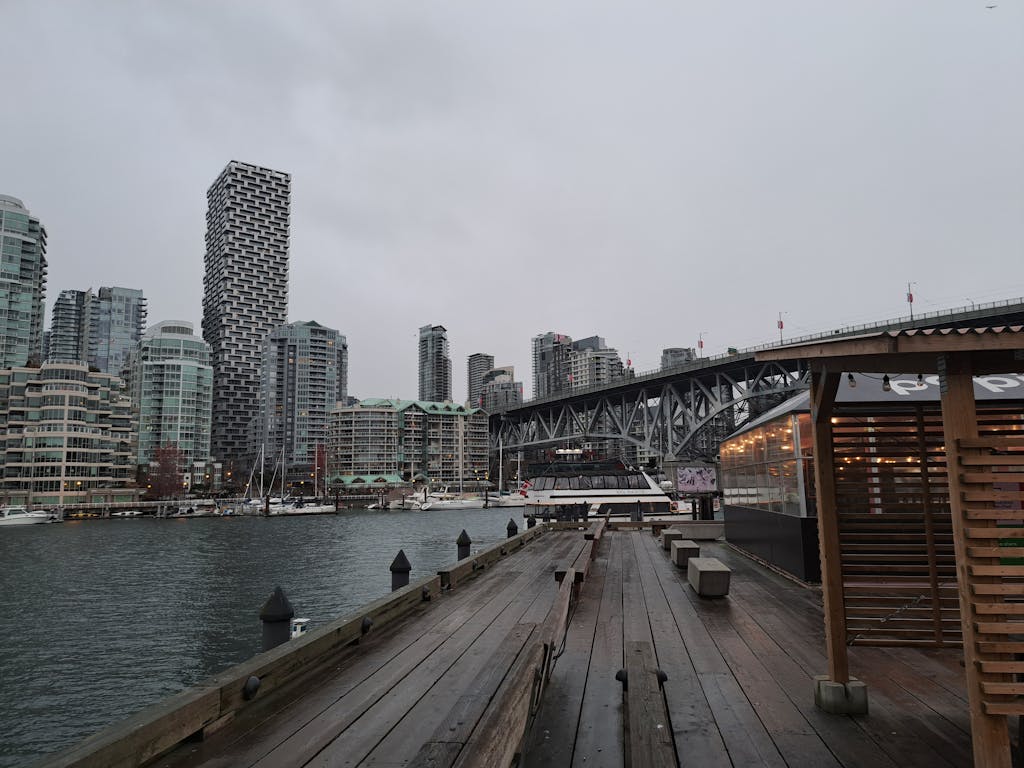 Scenic view of Vancouver's skyline with unique architecture and bustling waterfront.