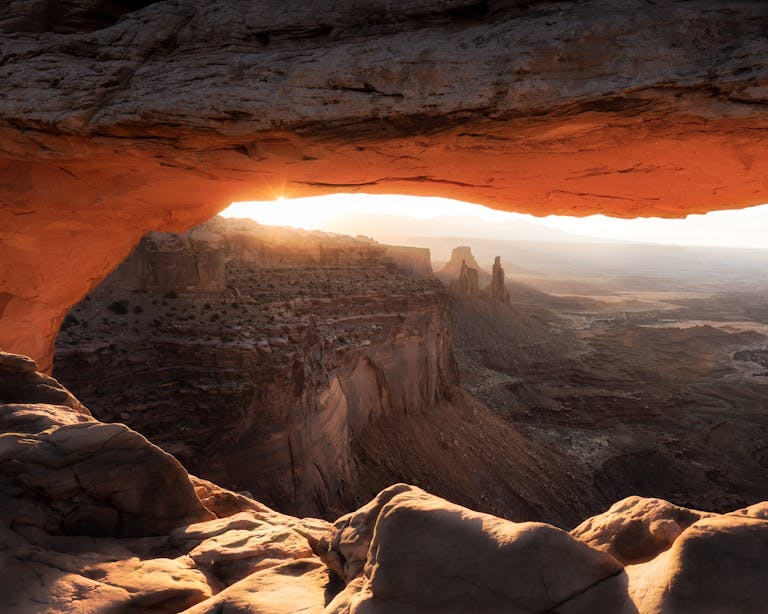 Stunning sunrise view through Mesa Arch in Canyonlands National Park, Utah.