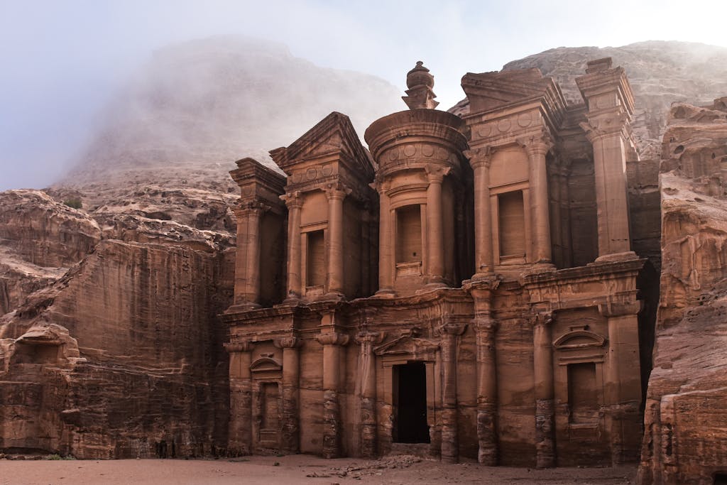 The Monastery in Petra, Jordan, revealing ancient architectural splendor amidst desert landscapes.